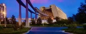 Night view of Disneys Contemporary Resort with monorail