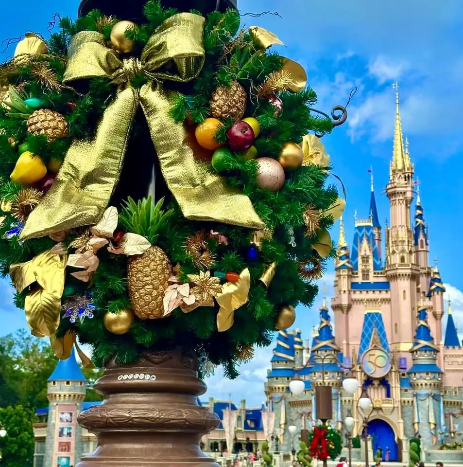 Holiday wreath decoration in front of Cinderella's Castle in Magic Kingdom