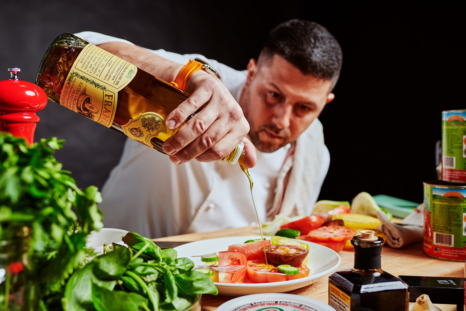 Action-shot of Michelin-starred Chef Joe Isidori preparing a meal for his new restaurants coming to Downtown Disney