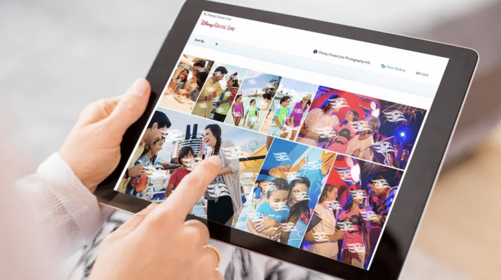 Image of a person's hand searching through images taken with the Unlimited Photo Package from a Disney Cruise Line vacation