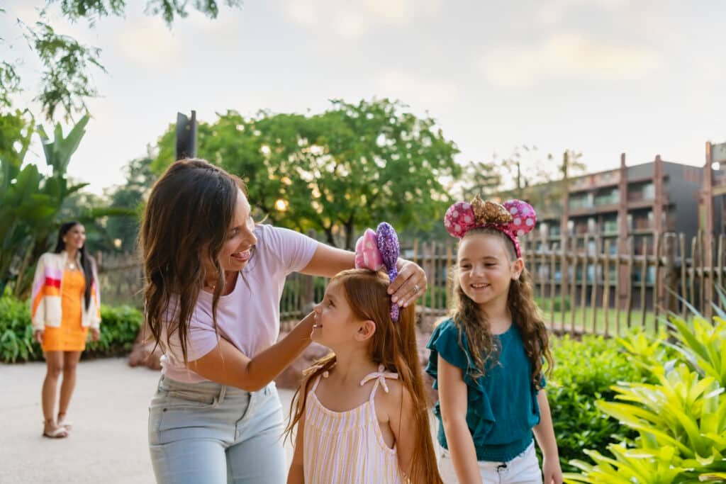 Mom and girls walking through animal kingdom lodge.