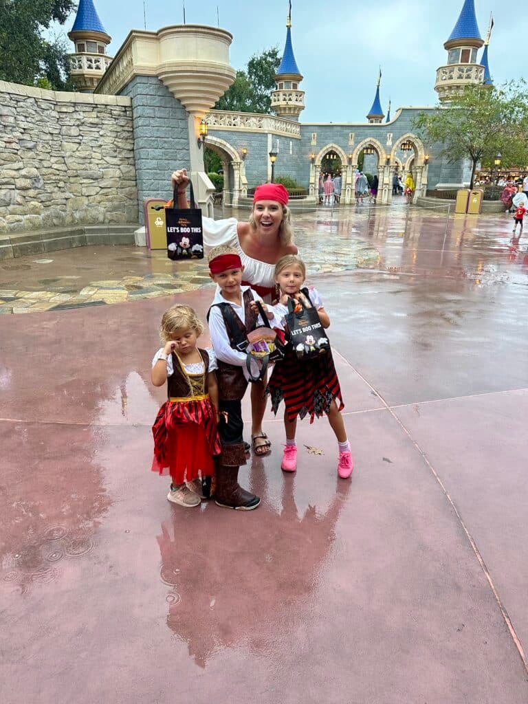 A family in Magic Kingdom showing off their Mickey’s Not So Scary candy haul!