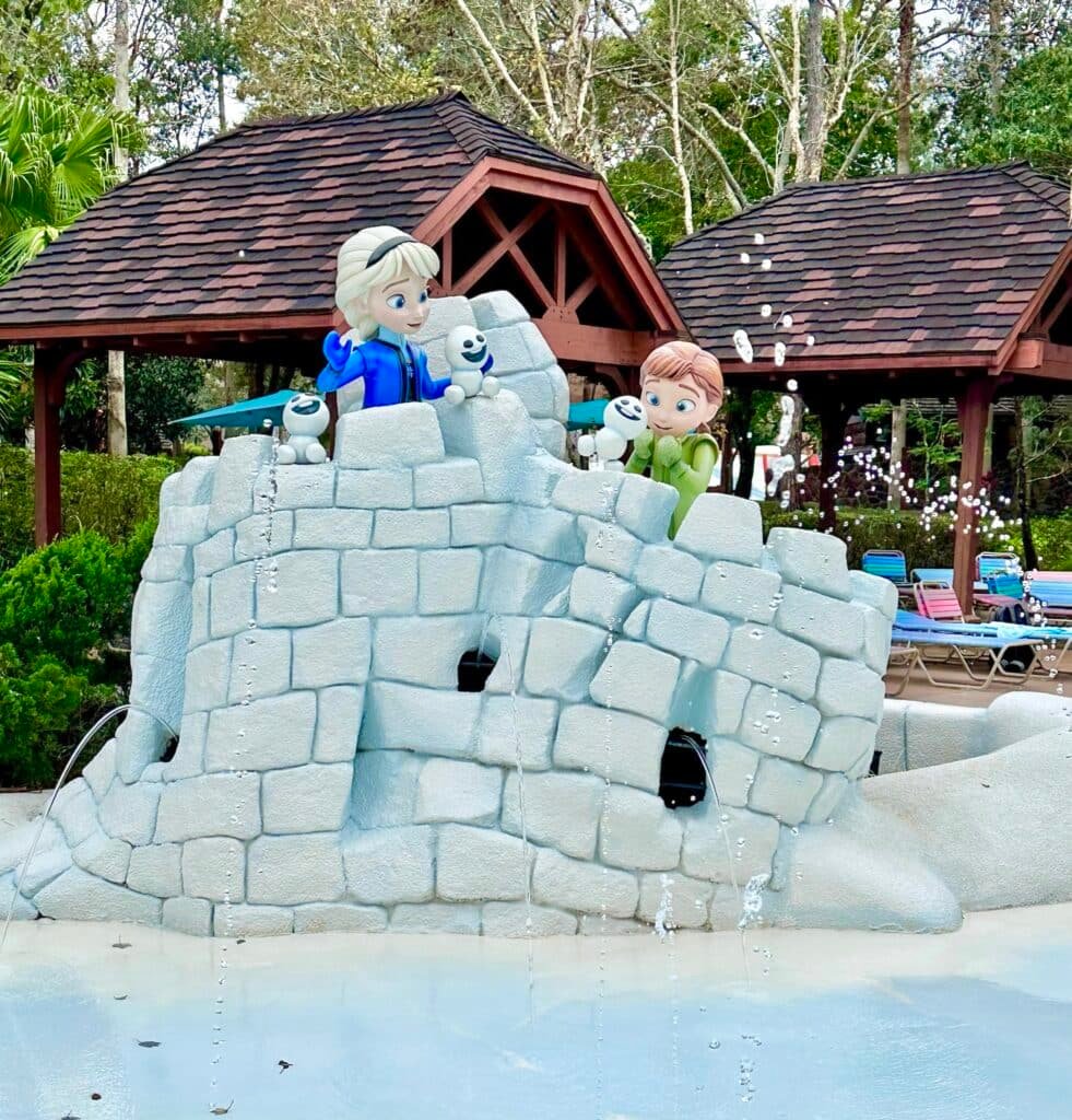 Anna and Elsa statue of them making an Igloo at Disney's Blizzard Beach