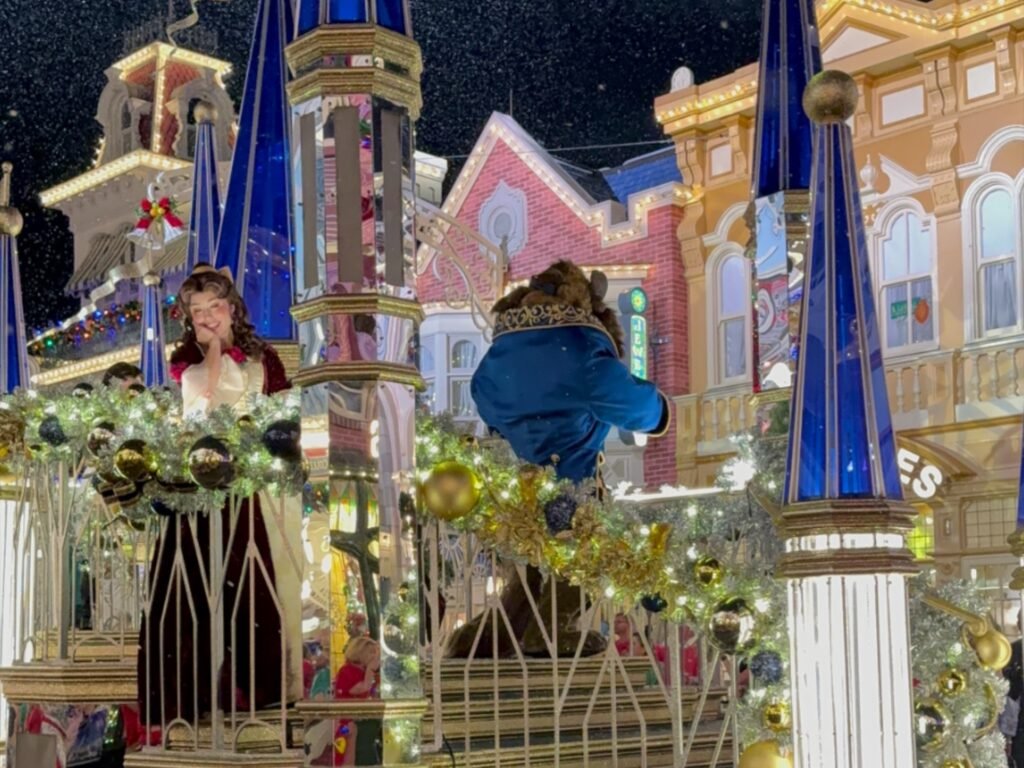 Belle and Beast on the Mirror float for Mickey's Once Upone a Christmastime Parade