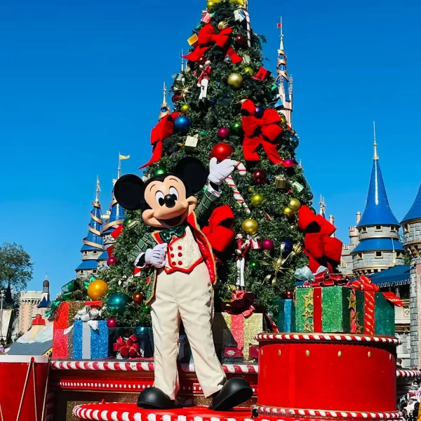 Festive Mickey Mouse on Holiday Parade Float at Mickey's Very Merry Christmas Party.